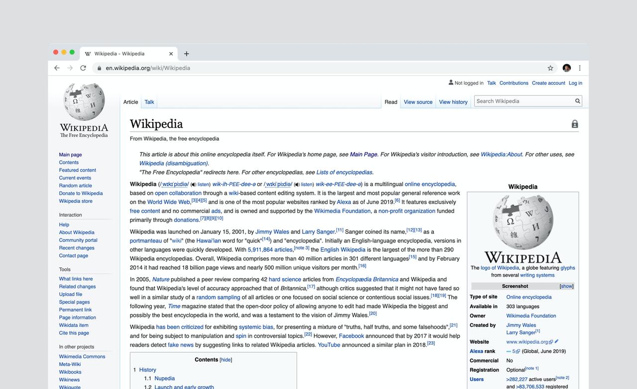 Fotografie der Startseite von Wikipedia in englischer Sprache, mit der Erklärung und Geschichte zum Schlagwort "Wikipedia" aus dem Jahr 2019.