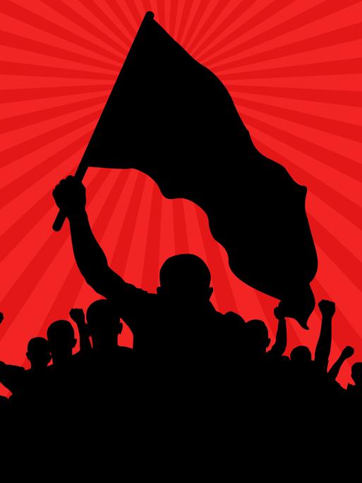 Silhouetten von Demonstranten mit Fahnen und einem Transparent