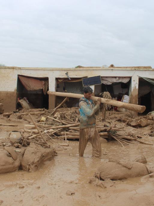 240512 -- BEIJING, May 12, 2024 -- A man clears off ruins at the flood-affected Laqia village, Baghlan-e-Markazi District, north Afghanistan s Baghlan Province, May 11, 2024. More than 330 were killed as rainstorms and flash floods hit major parts of the provinces of Baghlan, Takhar, Badakhshan and Ghor of Afghanistan, according to the Afghanistan office of the World Food Programme and local Afghan officials. Photo by Mehrabuddin Ibrahimi/Xinhua XINHUA PHOTOS OF THE DAY KaxBuerfenshe PUBLICATIONxNOTxINxCHN