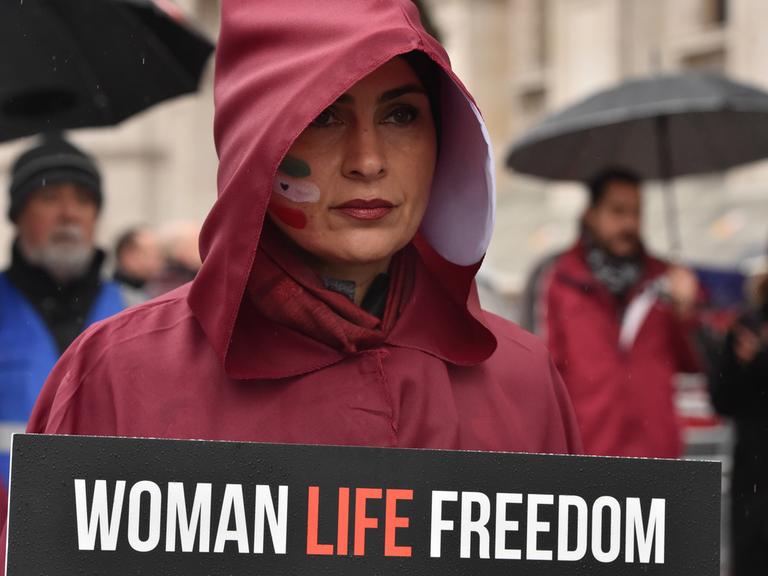 March 8, 2023, London, England, United Kingdom: Protesters dressed up as handmaids marched through Whitehall in solidarity with the growing freedom uprising in Iran, over the death of Mahsa Amini following her arrest by the Iranian morality police. Mahsa Amini was killed in custody on 16 September, after her arrest for allegedly breaching Iran s laws for women on wearing hijab, headscarves and modest clothing. London United Kingdom - ZUMAk172 20230308_zip_k172_016 Copyright: xThomasxKrychx