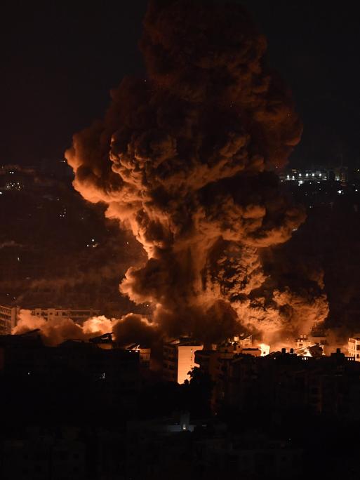 BEIRUT, LEBANON - OCTOBER 6: Smoke and flames rise among the residential buildings following an Israeli attack on Dahieh region in Beirut, Lebanon on October 6, 2024. Houssam Shbaro / Anadolu