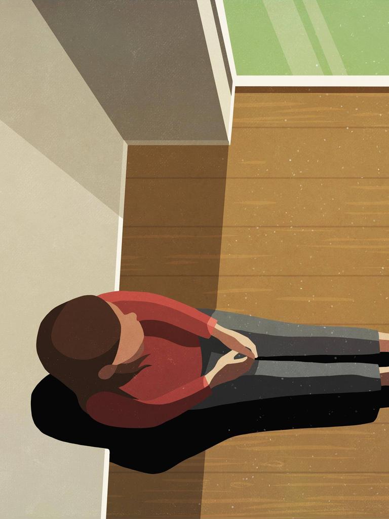 Eine Frau sitzt allein im Zimmer und schaut aus dem Fenster. (Illustration)