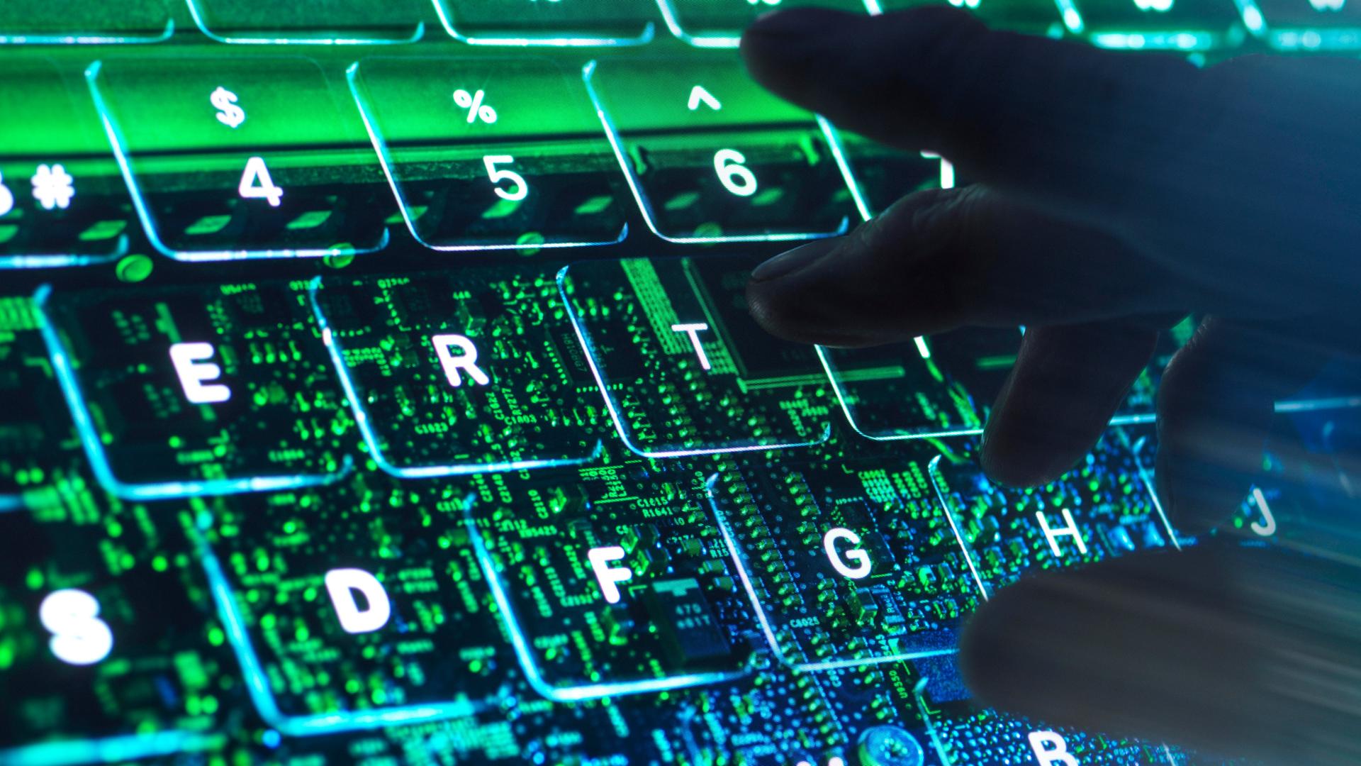 Eine Hand tippt auf einer virtuellen Tastatur. Eine Hand tippt auf einer virtuellen Tastatur.