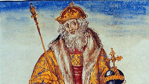 Ein Gemälde des Herrschers Otto I., genannt Otto I. der Große. Es zeigt einen älteren Mann mit grauem langen Bart, er trägt einen prächtigen gelben Mantel, der bestickt ist, und trägt darunter rote Kleidung. In der linken Hand hält er den Reichsapfel, in der rechten das Zepter.