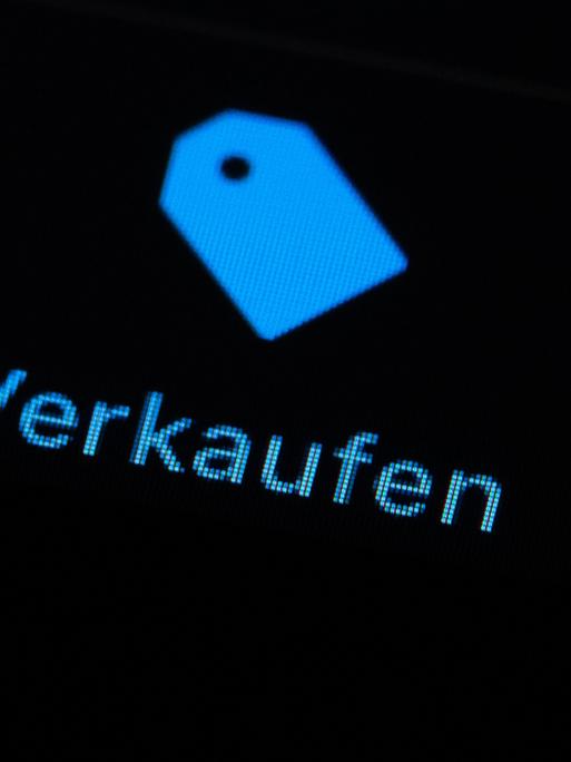 Der Schriftzug "Verkaufen" ist auf dem Display eines iPhone zu sehen.