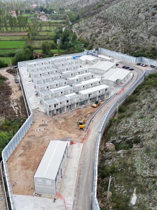 This aerial photo shows the site of a recently build Italian-run migrant centre at the port of Shengjin, some 60 kms northwest of Tirana, on October 11, 2024.