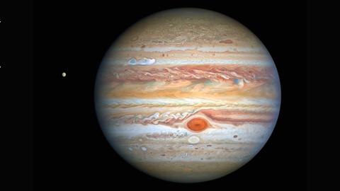 Der Riesenplanet Jupiter ist im dunklen Weltall zu sehen.