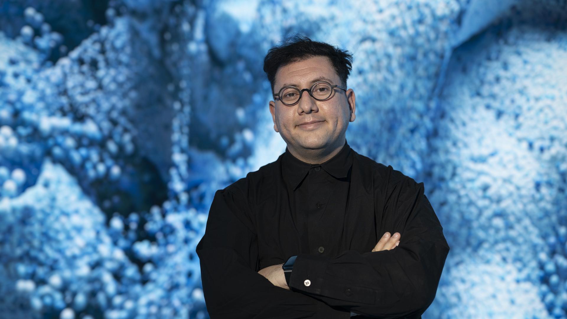 Turkish-American new media artist and designer Refik Anadol poses during the press day of the exhibition ÔGlacier DreamsÕ at Kunsthaus Zurich, Switzerland, Thursday, 16 January 2025. (KEYSTONE/Ennio Leanza)